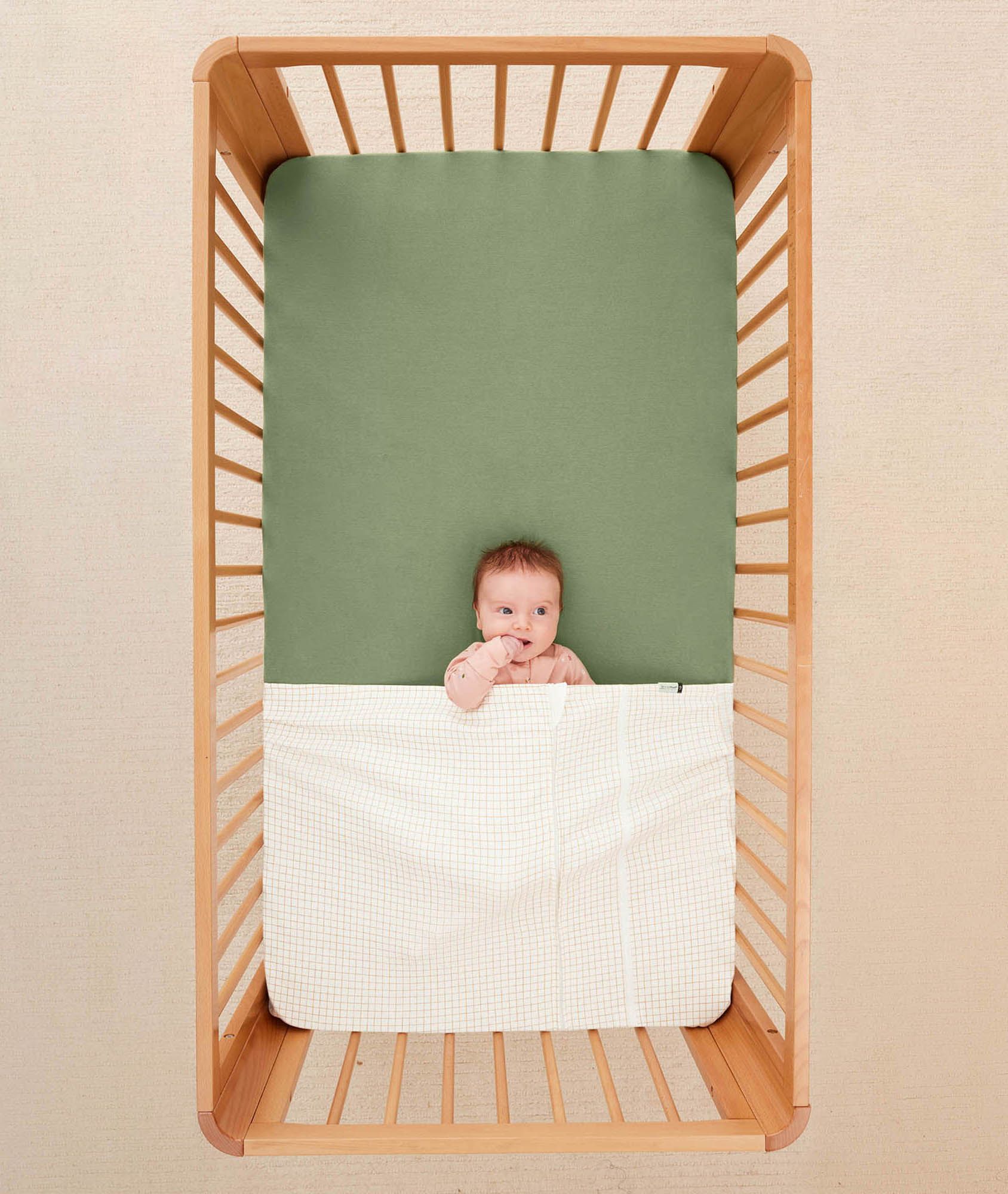 Rolled blanket under crib sheet sales